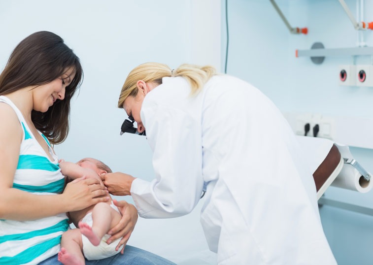 new-born-baby-health-checkup-front-of-her-mother